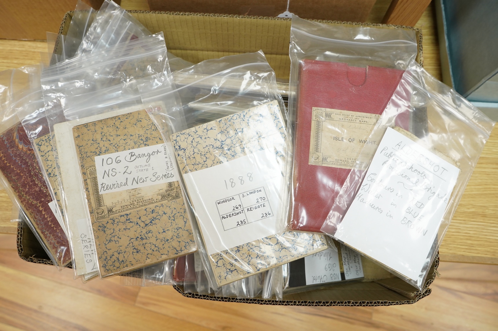 A collection of mid 19th to early 20th century Ordnance Survey maps, including some unusual issues, quarter-inch large sheet folded maps with marbled covers and green cotton edges, etc.
